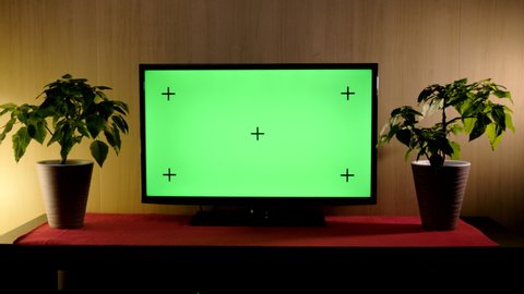 TV with green screen composited. TV or television - green screen - room - on the table. 