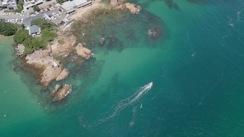 Vertical aerial shows the clear green water of lagoon at Knysna Heads