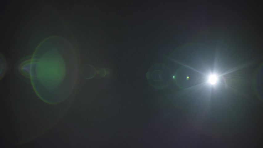 A blue lens flare appearing at the right side slowly moving towards left side captured using a 25mm Precise lens from the Lucent Precise collection - Lens Flare Video Element.