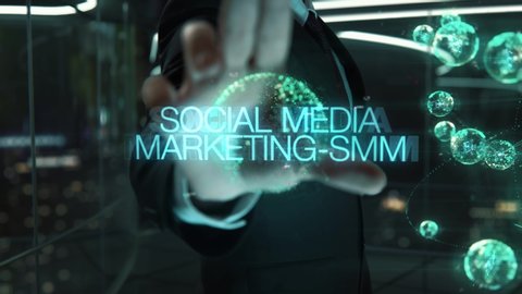 Businessman with Social Media Marketing-SMM hologram concept