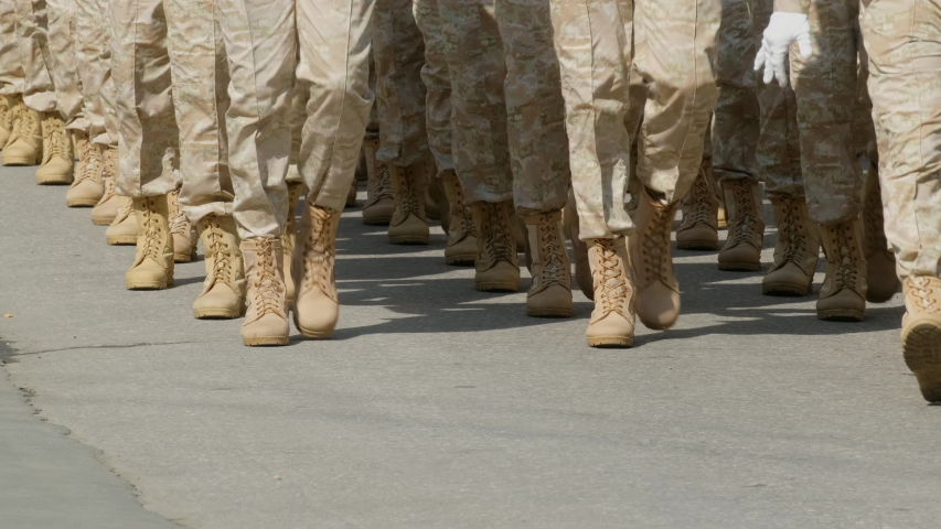 Leg soldier in military american uniform marching parade victory day. Synchronized even step officer 4K. American army demonstrate clothes. March leg troops soldiers in military boots stepping rhythm. Royalty-Free Stock Footage #1057054217