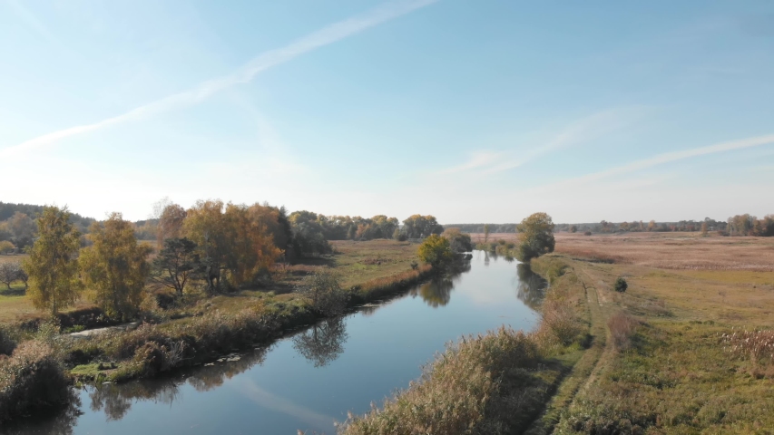 Flight under the river in the countryside.