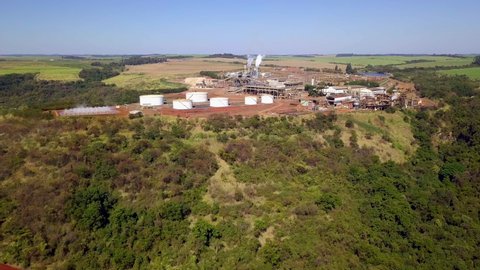 Aerial of sugarcane methanol plant in Brotas, Sao Paulo. Rising slight pan