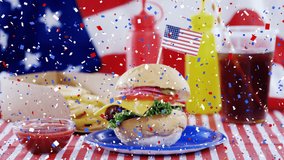 Animation of falling confetti over burger with small U.S. flag with U.S. flag in the background. United States of America flag and holiday concept digital composition. - Powered by Shutterstock - Get 15% off with code: PIKWIZARD15
