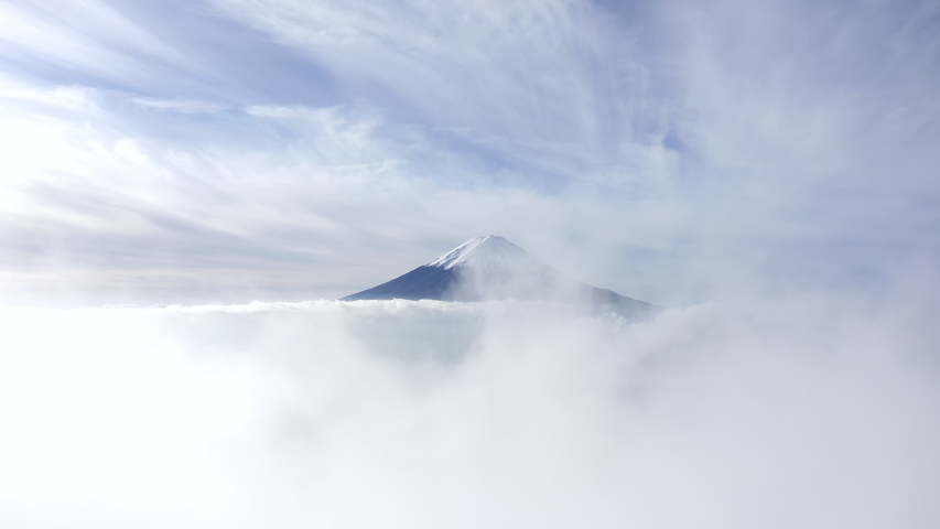 Aerial view of Mount Fuji with beautiful clouds above the clear sky. Japan Royalty-Free Stock Footage #1057084052