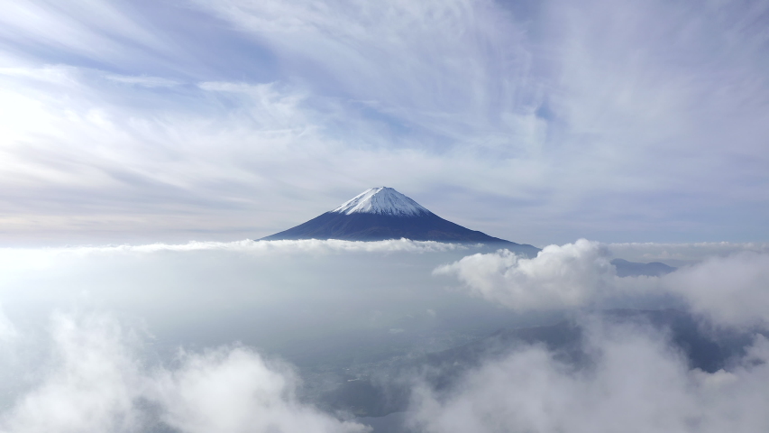 Aerial view of Mount Fuji with beautiful clouds above the clear sky. Japan | Shutterstock HD Video #1057084052