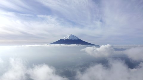 Aerial view of Mount Fuji with beautiful clouds above the clear sky. Japan