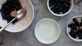 Making Blueberry Cobbler- Adding Berries to Individual Dishes