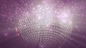 Animation of a shower of pink spots of light floating over a turning disco ball. Nightlife disco party glamour concept, digital composite video - Powered by Shutterstock - Get 15% off with code: PIKWIZARD15