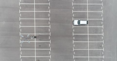 Aerial footage of empty parking lot. Road marking. Parking space