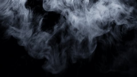 Dry ice clouds overlay background. White abstract smoke slowly floating through black surface. Atmospheric fog haze effect. Real mystery steam. Halloween concept footage.