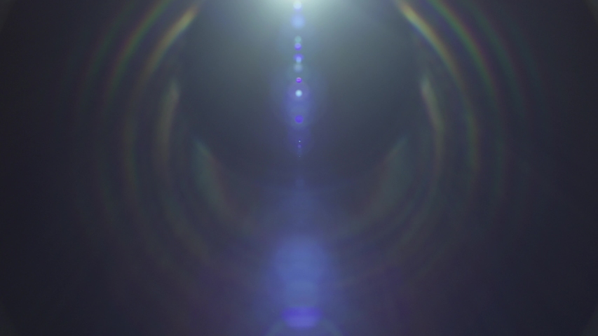 Spherical lens flare with a violet hue with the flickering effect shot on a 290mm parfocal lens from the Lucent Zoom Collection - Lens Flare Video Element