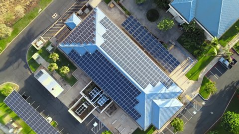 Sustainable building in USA. Solar panels in business center in America. Renewable electric energy. Drone aerial shot 4k. 