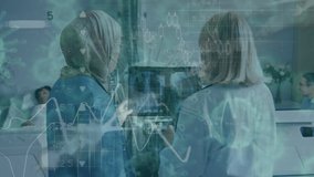Animation of covid-19 cells floating and data processing over a view of two multi ethnic female healthcare workers discussing in a hospital. Coronavirus Covid-19 pandemic concept digital composite. - Powered by Shutterstock - Get 15% off with code: PIKWIZARD15