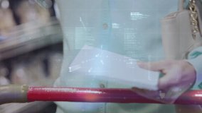 Animation of woman shopping in grocery store with shopping list and shopping trolley and financial data processing. Global finance and shopping concept digital composite. - Powered by Shutterstock - Get 15% off with code: PIKWIZARD15