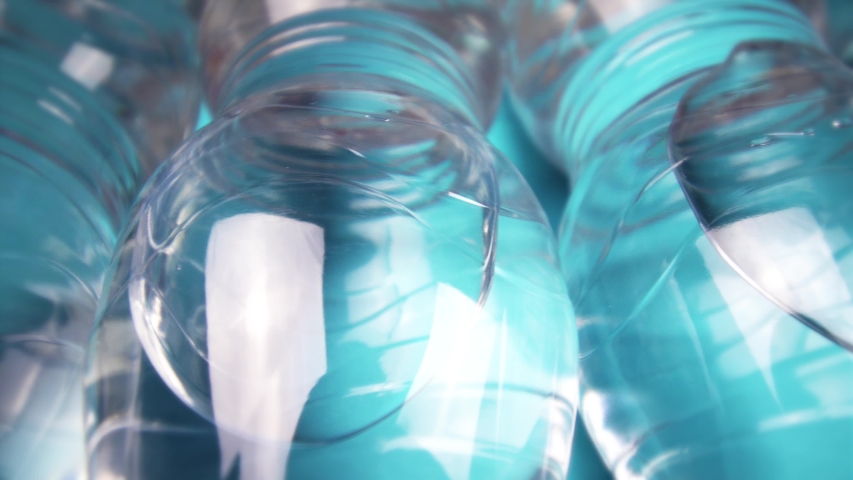 Bottles with mineral water on light blue background closeup | Shutterstock HD Video #1057119839