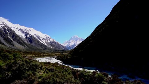 Sunny Hooker valley and Hooker river with Mount Cook