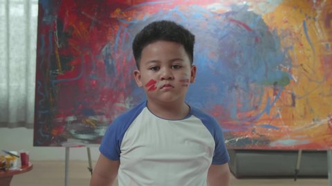 Dirty Little Boy With Abstract Painting

