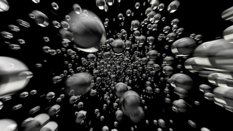 Fast flight through an underwater water cloud of bubbles on a black background. Bubble mass flow. Loop. 3d animation in 4K Ultra HD.
