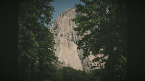 Driving towards El Capitan granite rocks in Yosemite National Park. Vintage Film Look.