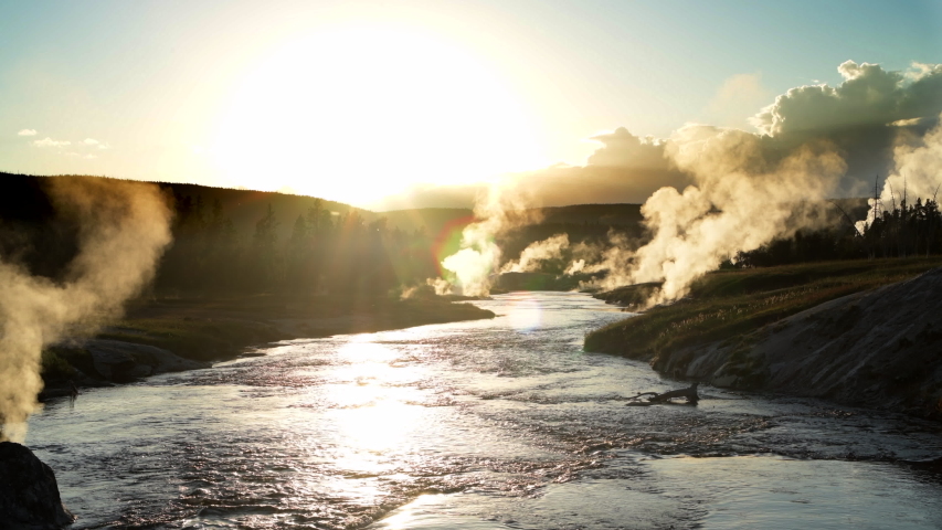 Sunsets over Firehole River in Yellowstone National Park Upper Geyser Basin. Great tourist destination in the United States.