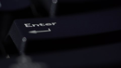 Macro view of Human finger pressing a Backspace key on the computer keyboard