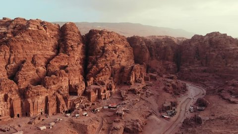 Epic view of the Petra valley in Jordan with its temples in the middle of a rocky and mountaineous landscape, an Unesco heritage site, ancient Nabatean Kingdom 