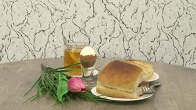 Tasty breakfast with bread meat sandwich and tea cup on wooden table background.