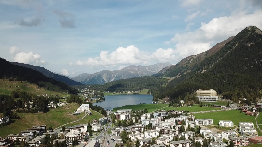 Aerial view of Davos city and lake. Davos is swiss city, famous location of annual meetings of World Economic Forum.