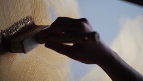 Woman hand artist paints draws, creating new art work on golden canvas enjoying process of painting. Wide brush applying yellow gold oil paint. Close up color palette materials choice for creativity - Powered by Shutterstock - Get 15% off with code: PIKWIZARD15