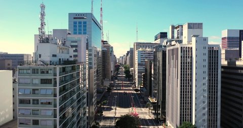 Flying over Paulista avenue during the covid 19 quarantine, empty streets on the financial center of Sao Paulo, Brazil.