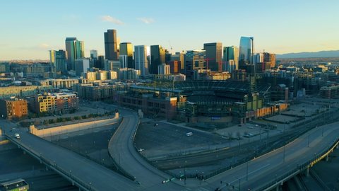 Aerial view of downtown Denver showing empty streets due to covid-19. Global pandemic corona virus. Denver skyline and Coors Field.