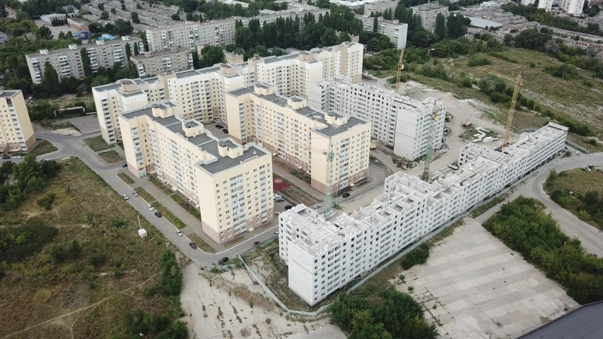 Aerial close in front of windows modern dormitory area houses buildings 