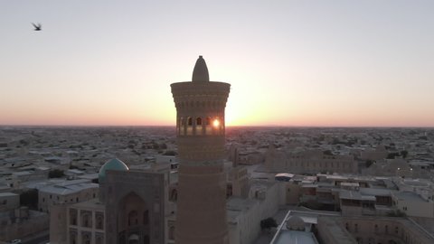 Po-i-Kalyan mosque complex in Bukhara and Kalyan Minaret at sunset, shot by a drone