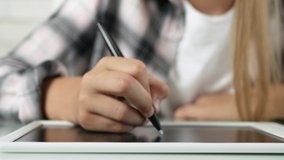 Kid Playing Tablet in Playroom, Child Writing Homework for School, Girl Studying at Home, Homeschooling, Online Education - Powered by Shutterstock - Get 15% off with code: PIKWIZARD15