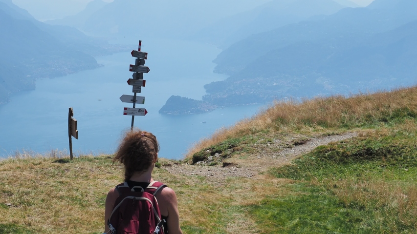Trekking scene on Lake Como alps (the arrows indicates the names of the locations reached by the trails)