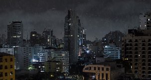 Big city on a rainy night. View from the buildings of the city and the rain running down outside of the window. Animation.