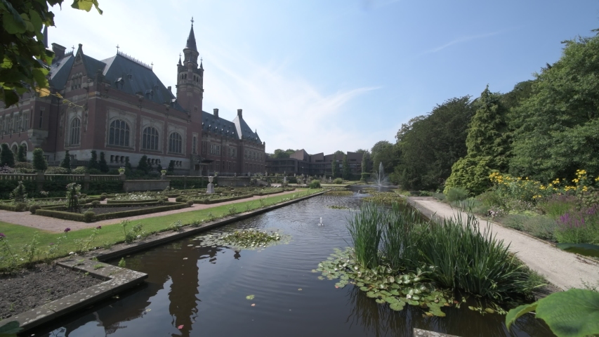 THE HAGUE, 10 August 2020 - Garden and park of the most visited monument, Peace Palace on the pond in the garden of the International Court of Justice
