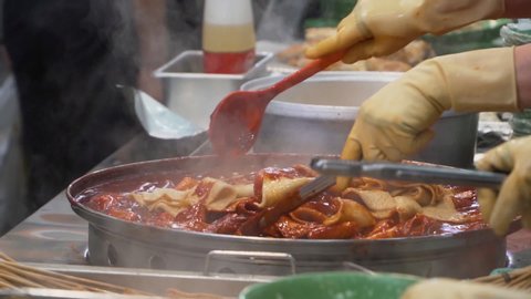 Tteokbokki is the most popular Korean street food. This is a stir-fried rice cake in a spicy red soup. People can see a lot of Tteokbokki shop in Korea.