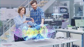 Industry 4.0 Engineering Facility: Female Designer with Engineer Use Smartphone with Augmented Reality App to Manipulate 3D Engine. Specialists Working on Eco-Friendly Green Energy Turbine Concept - Powered by Shutterstock - Get 15% off with code: PIKWIZARD15
