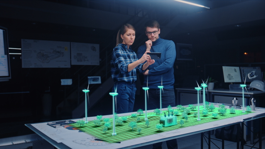Renewable Energy Engineers Design 3D Wind Turbine Park Using Augmented Reality Hologram and Smartphone. Specialists Use Virtual Reality App to Work on Green Energy Environmental Power Production Royalty-Free Stock Footage #1057229620