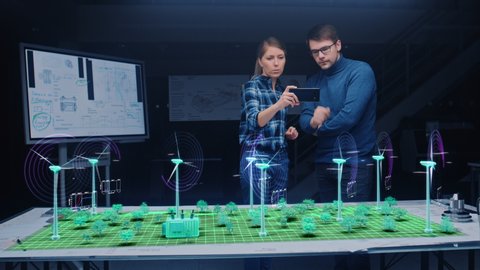 Renewable Energy Engineers Design 3D Wind Turbine Park Using Augmented Reality Hologram and Smartphone. Specialists Use Virtual Reality App to Work on Green Energy Environmental Power Production