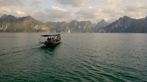 Drone shot of a boat ride in the Koh Sok national park in Thailand.