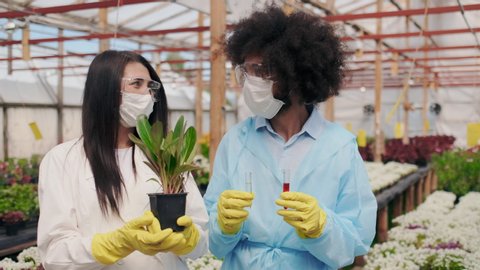 Portrait of Confident and Succesful Biologist or Scientist After Science Dna Research. Mixed race People Looking in Camera in Greenhouse. Biotechnology, Biochemistry, Bio-fuel, Innovative Method.