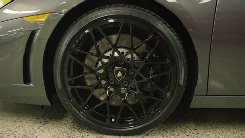 Montreal, Canada – May 13, 2017: Lamborghini Huracan supercar front wheel. black Cordelia style rim with the bull logo and high performance brakes.
