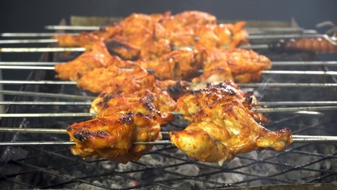 Cooking chicken tikka barbecue charcoal grill stock video footage. Chicken, Delicious pieces perfectly red chicken meat. 