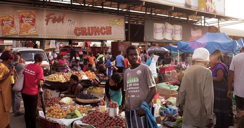 Lusaka, Zambia / Africa - June 24 2019 Local people in the market in Lusaka City in Zambia. Fruit and Vegetables being sold by a street vendor on Lusaka's streets.