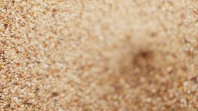 Quicksand Danger. Hourglass, Countdown, Threat and Maelstrom. Danger of sand vortex and loose sand. Supter macro - Powered by Shutterstock - Get 15% off with code: PIKWIZARD15