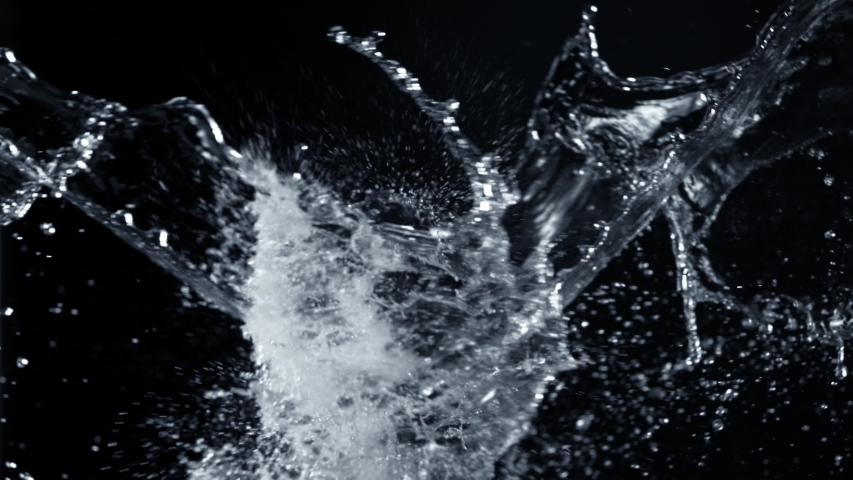 Super Slow Motion Shot of Side Water Splash Isolated on Black Background. Soft Focus Royalty-Free Stock Footage #1057241611