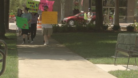 Shelby, N.C./ USA-08/08/2020: A group of protesters gather to bring awareness to child trafficking, abuse, murder and satanic ritual abuse by the elites.